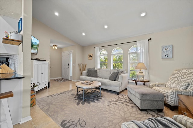 living room featuring light tile patterned floors and lofted ceiling