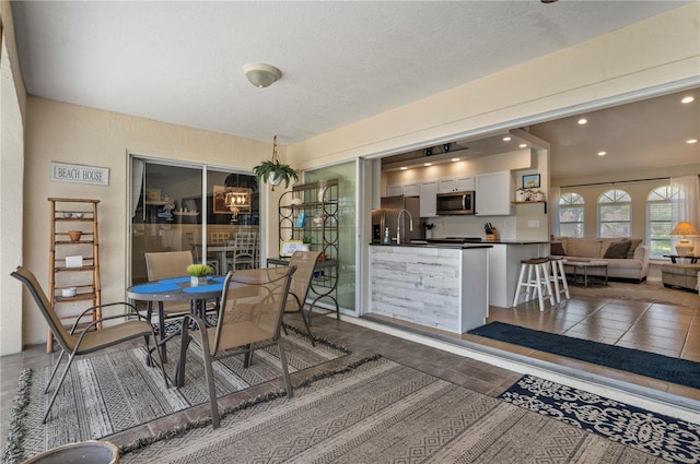 dining area featuring a textured ceiling