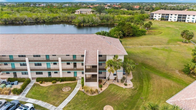 drone / aerial view with a water view