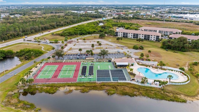 birds eye view of property with a water view