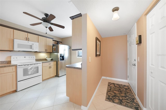 kitchen with ceiling fan, light tile patterned floors, light brown cabinetry, and white appliances