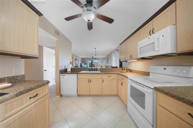 kitchen featuring light brown cabinetry, sink, kitchen peninsula, white appliances, and ceiling fan with notable chandelier