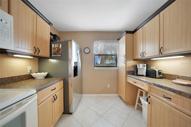 kitchen featuring stainless steel fridge with ice dispenser, a textured ceiling, and light brown cabinets