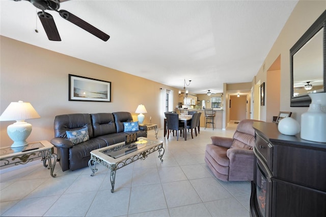 tiled living room featuring ceiling fan