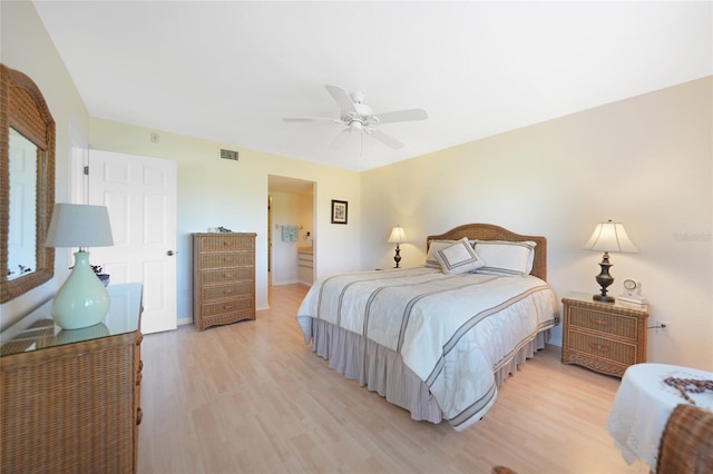 bedroom with ceiling fan and light hardwood / wood-style flooring