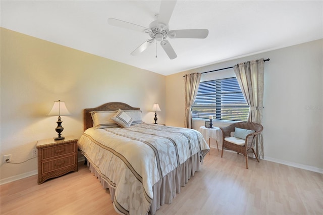 bedroom with ceiling fan and light wood-type flooring