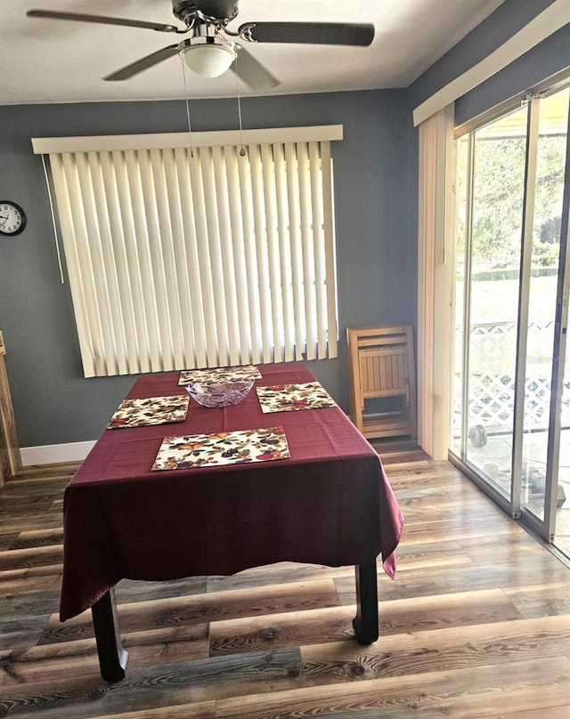 bedroom featuring ceiling fan, access to outside, wood finished floors, and baseboards