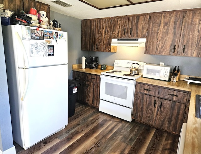 kitchen with white appliances, visible vents, dark wood-style flooring, dark brown cabinets, and under cabinet range hood