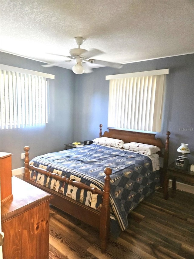 bedroom featuring a ceiling fan, a textured ceiling, and wood finished floors