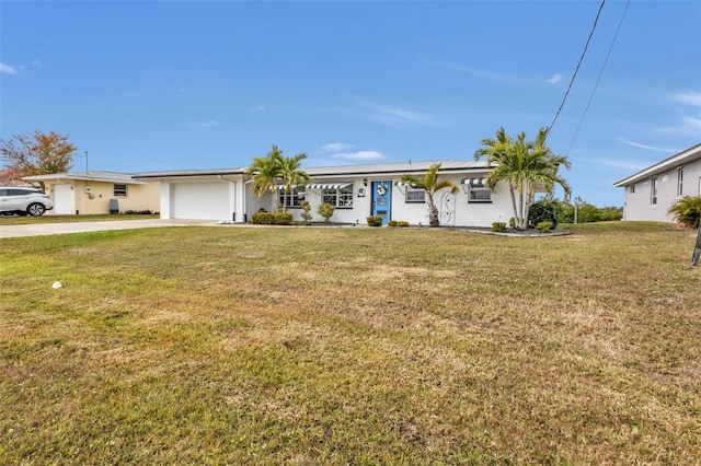 ranch-style home featuring a garage and a front lawn