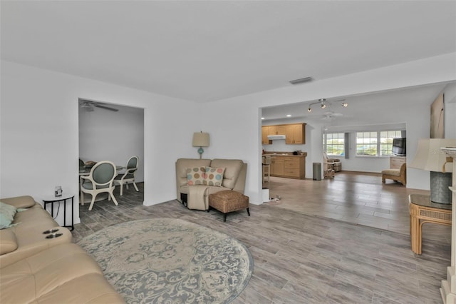 living room with light hardwood / wood-style flooring