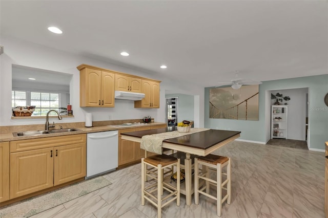 kitchen featuring ceiling fan, white appliances, light brown cabinetry, and sink