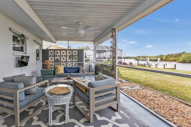 view of patio featuring a lanai, outdoor lounge area, and ceiling fan