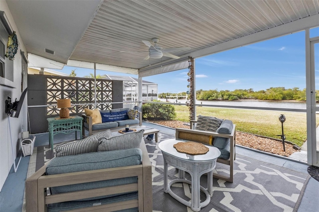 view of patio featuring ceiling fan, outdoor lounge area, and a lanai