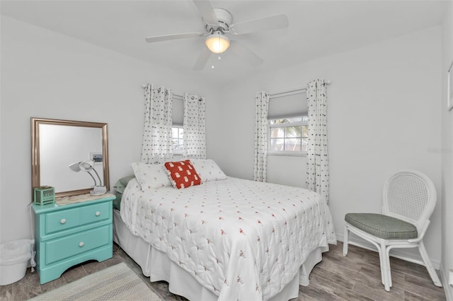 bedroom with hardwood / wood-style floors and ceiling fan