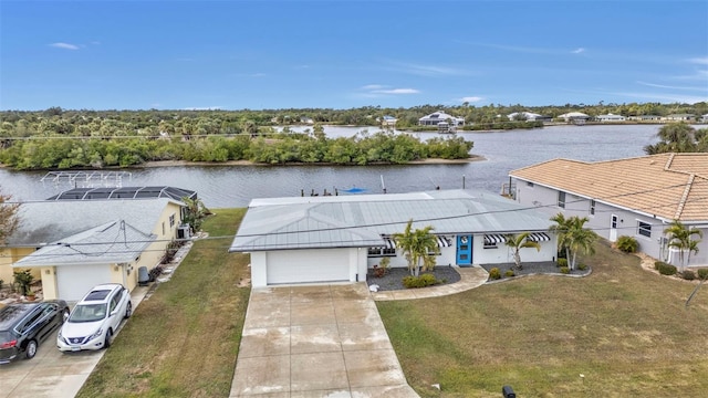 birds eye view of property with a water view