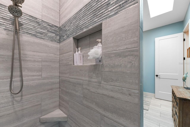 bathroom with tiled shower