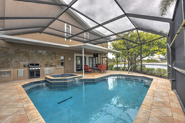 view of pool with an in ground hot tub, an outdoor kitchen, a grill, and a patio area