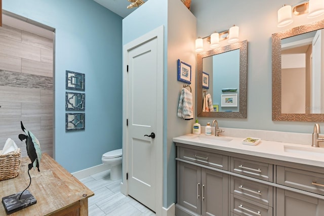 bathroom featuring vanity and toilet