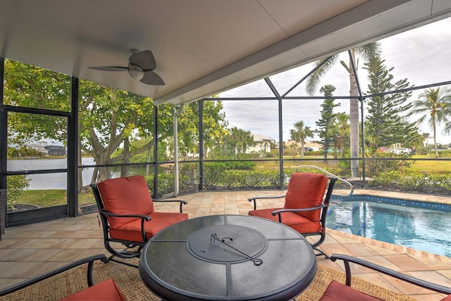 view of patio with ceiling fan and a lanai