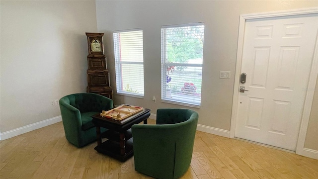 sitting room with plenty of natural light and light wood-type flooring