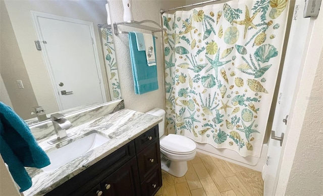 full bathroom with vanity, toilet, and shower / tub combo