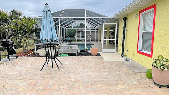 view of patio with glass enclosure