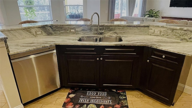 kitchen with a healthy amount of sunlight, sink, kitchen peninsula, and dishwasher