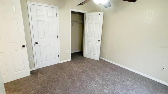 unfurnished bedroom featuring dark carpet and ceiling fan