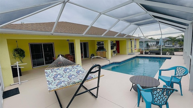 view of pool featuring a lanai and a patio