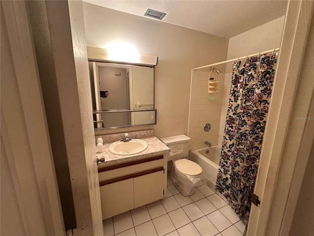 full bathroom with vanity, shower / tub combo with curtain, tile patterned floors, and toilet