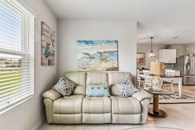 tiled living room with a wealth of natural light