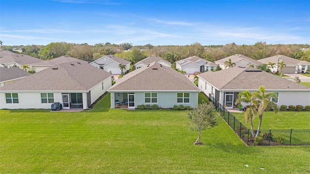 rear view of house with a lawn