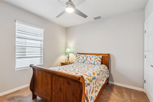 bedroom with carpet, multiple windows, and ceiling fan