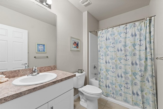 full bathroom with tile patterned floors, toilet, vanity, and shower / bath combo