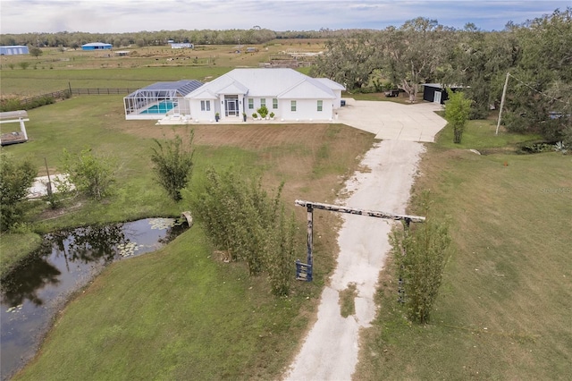 drone / aerial view featuring a water view and a rural view