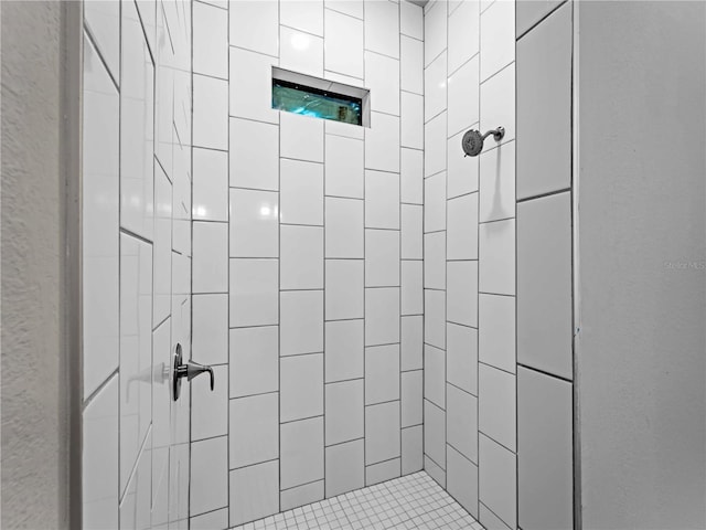 bathroom with a tile shower