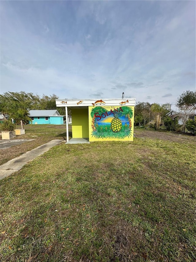 view of home's community with a lawn