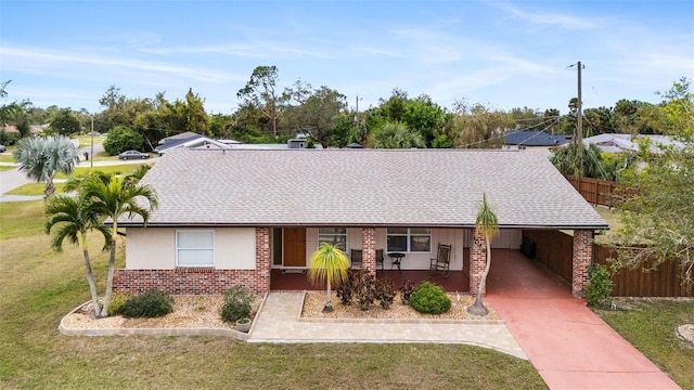 ranch-style house with a front lawn and a carport