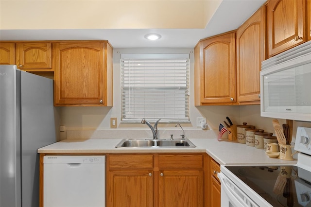 kitchen featuring sink and white appliances