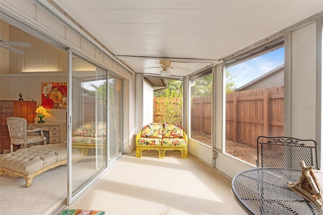 sunroom / solarium featuring ceiling fan