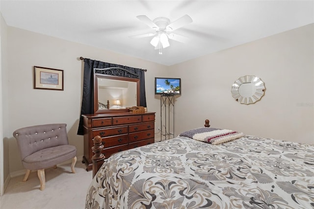 bedroom featuring light colored carpet and ceiling fan