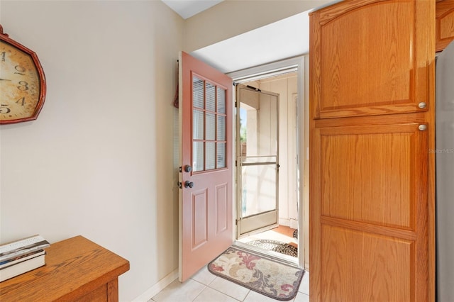 entryway with light tile patterned floors