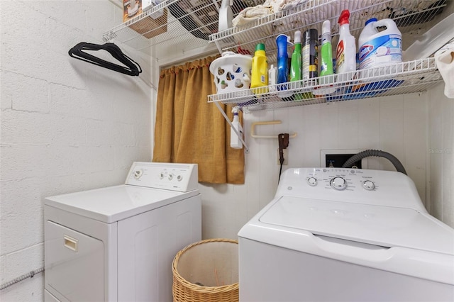 laundry area with washing machine and clothes dryer