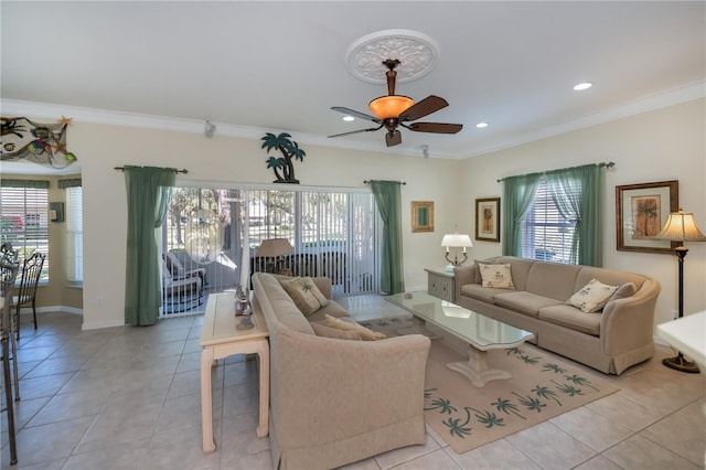 living room featuring crown molding, a wealth of natural light, ceiling fan, and light tile patterned flooring