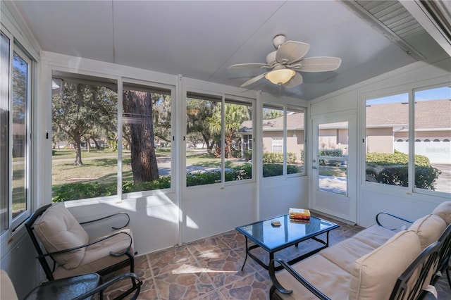 sunroom with ceiling fan and a healthy amount of sunlight