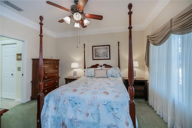 bedroom featuring crown molding, light colored carpet, and ceiling fan