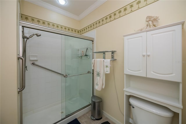 bathroom featuring ornamental molding, toilet, tile patterned floors, and a shower with shower door