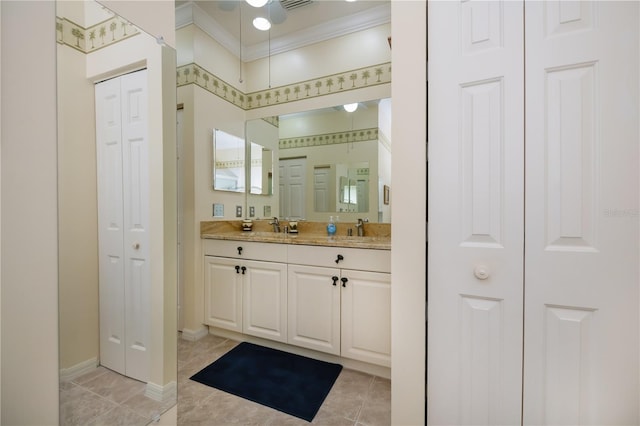 bathroom with tile patterned flooring, vanity, and crown molding