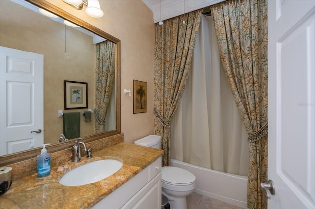 full bathroom featuring vanity, toilet, tile patterned flooring, and shower / bath combo